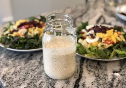 Homemade ranch dressing stored in a glass quart jar
